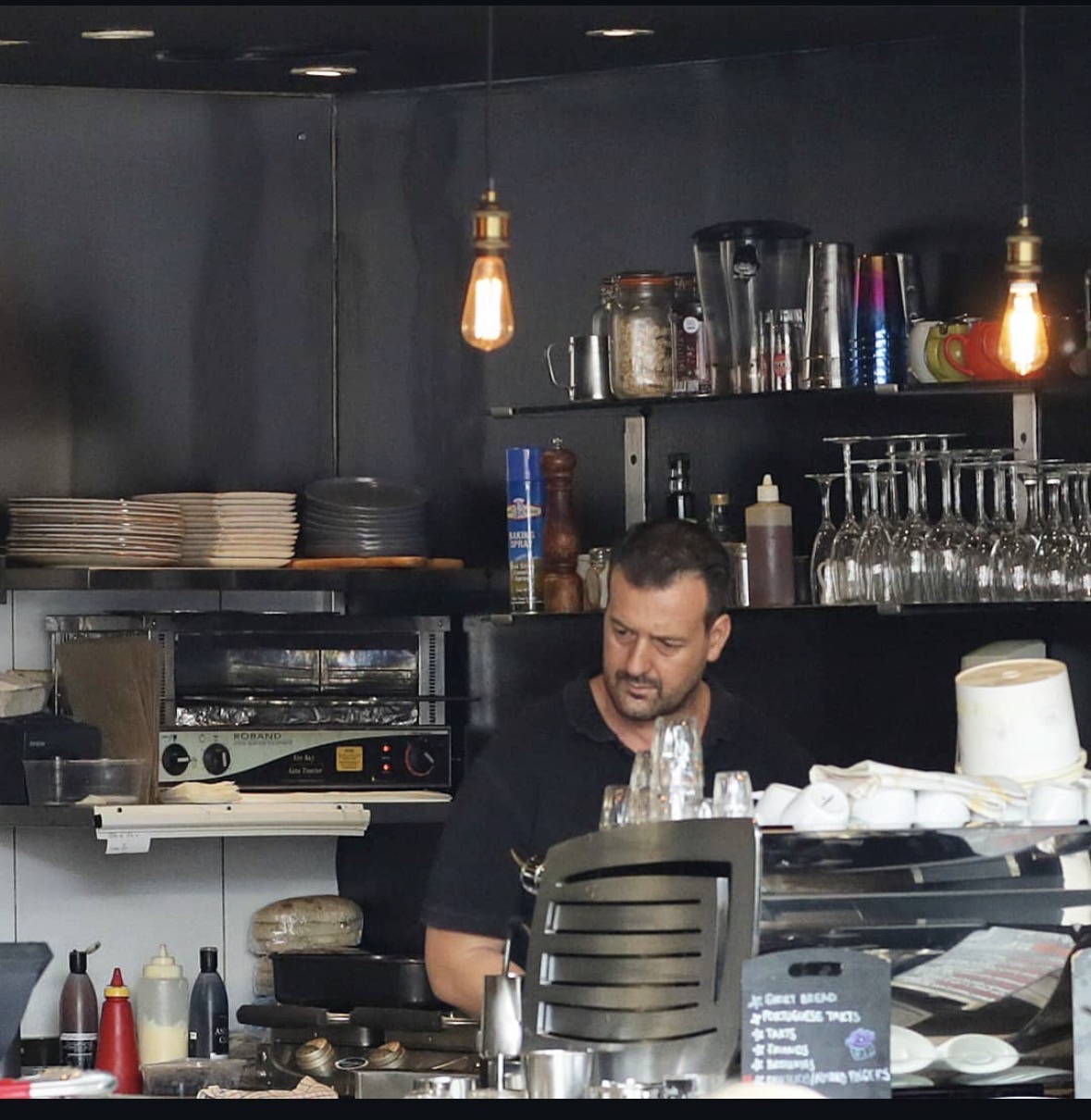 Coffee being prepared behind the counter at Zupano Espresso Bar